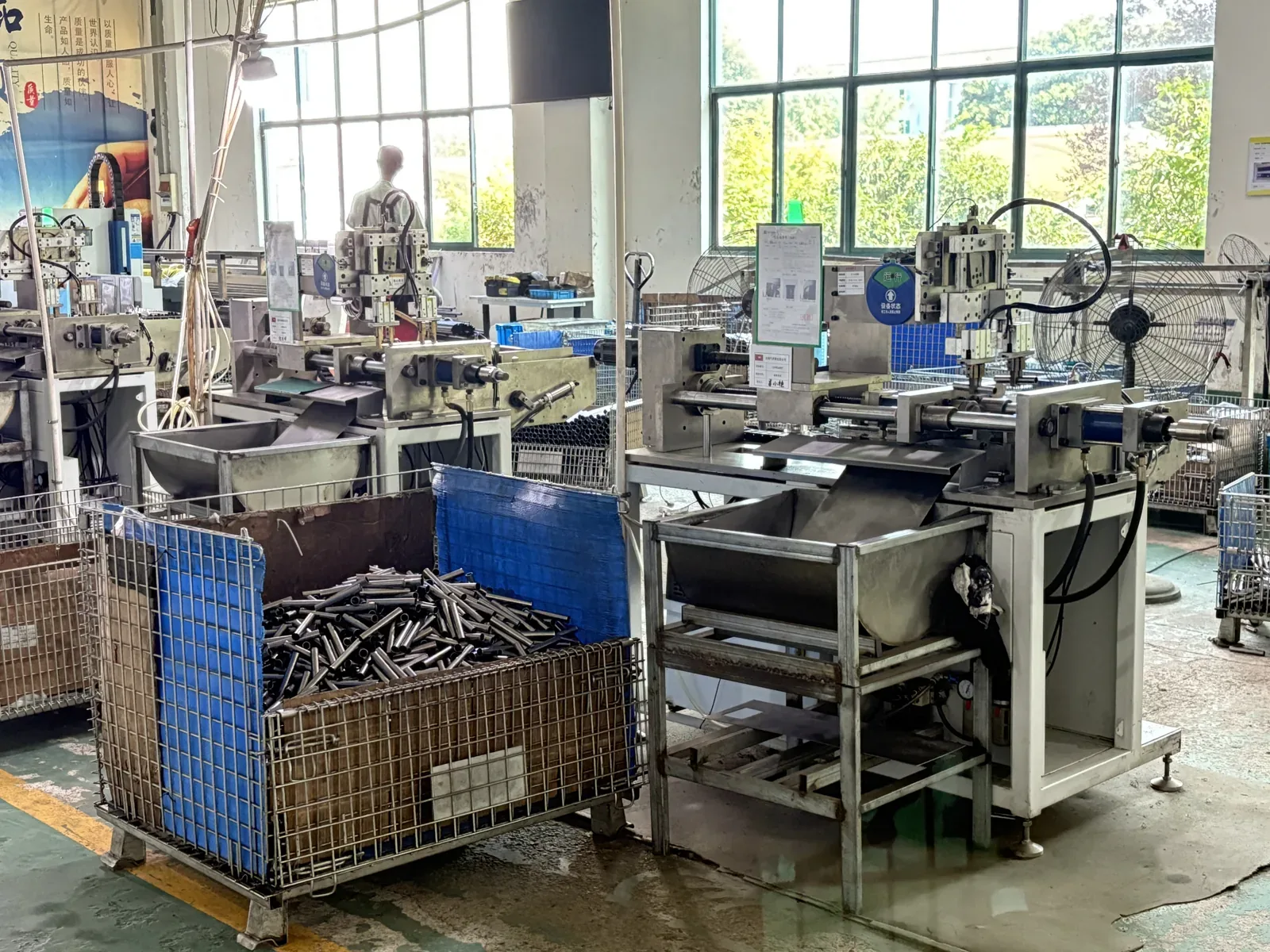 Gas spring component processing stations on the first-floor workshop