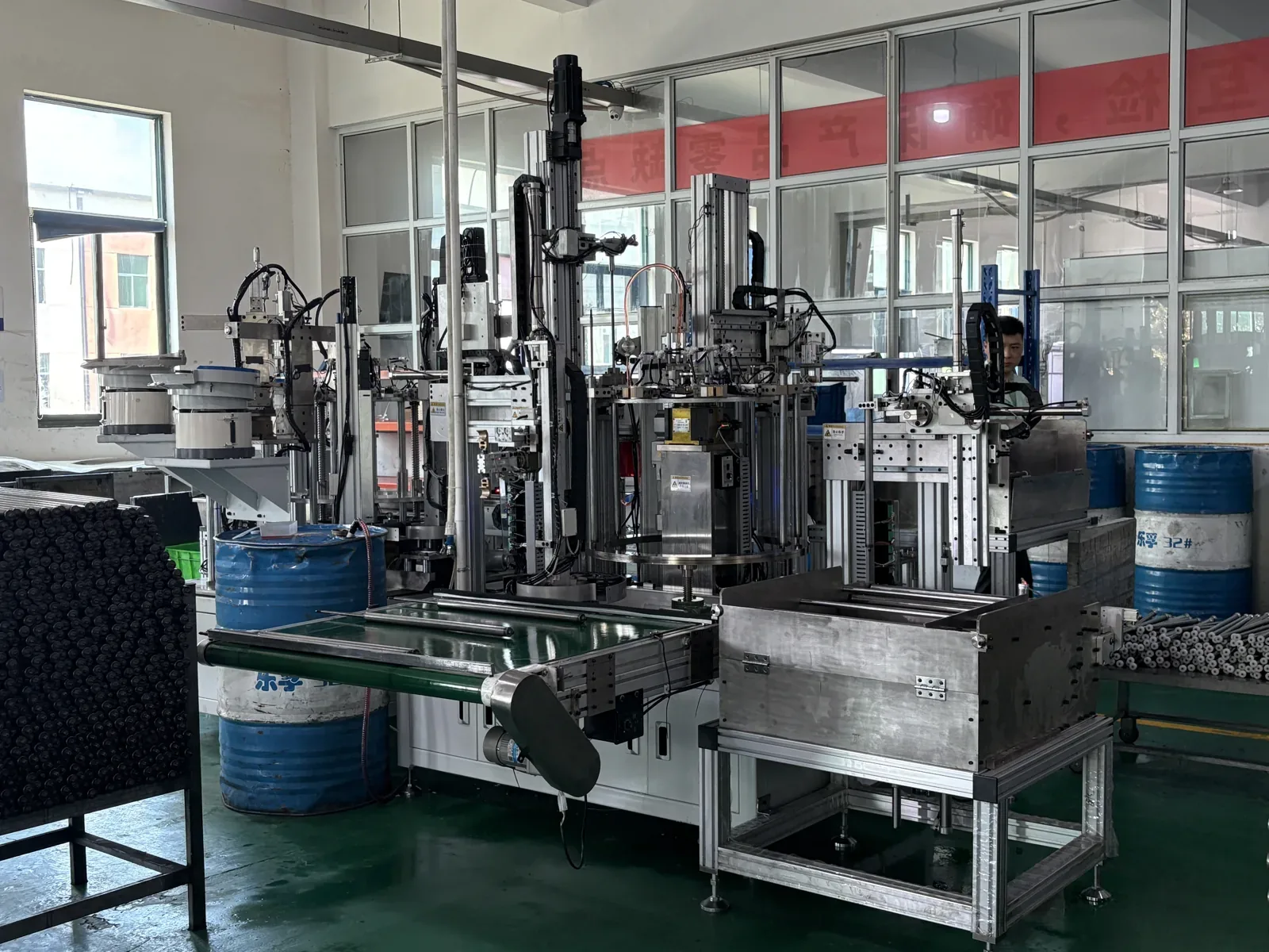 Automated gas spring assembly cell on the second-floor workshop