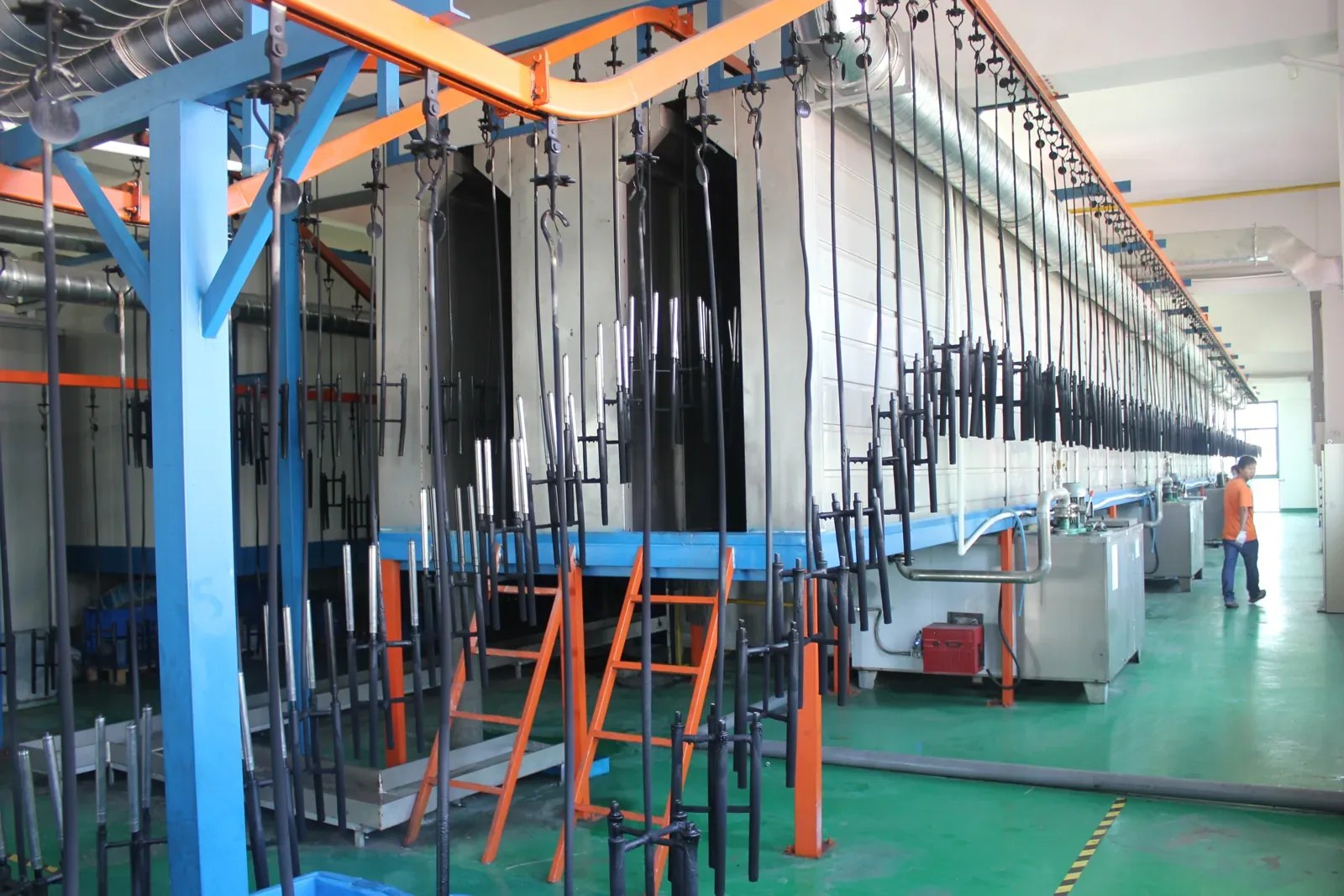 Overhead conveyor coating line for gas spring tubes